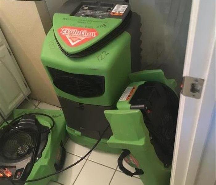 green drying equipment set up in a bathroom