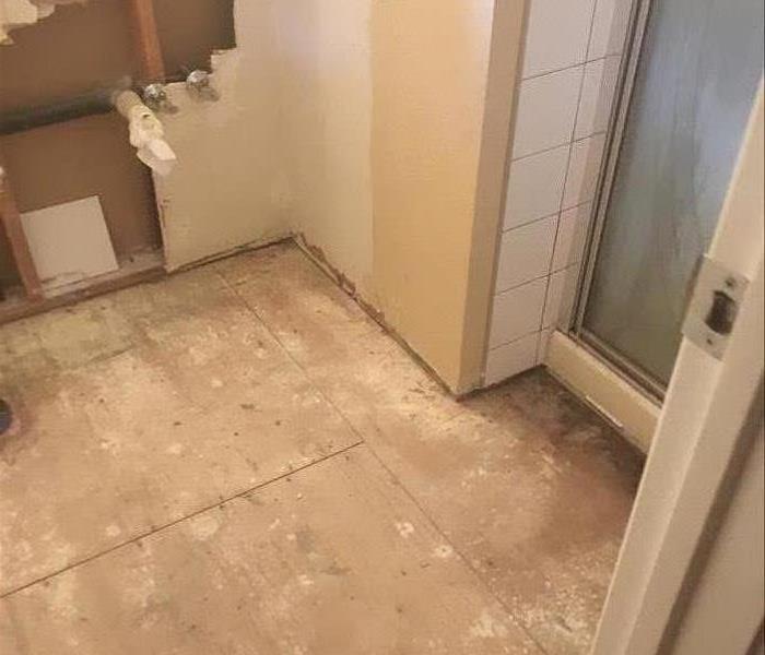 a bathroom with no flooring
