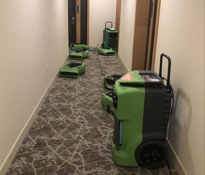 Drying equipment set up in commercial hallway.