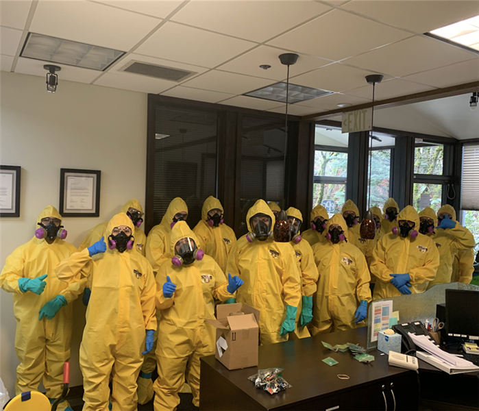 a group of guys in yellow suits and face maks