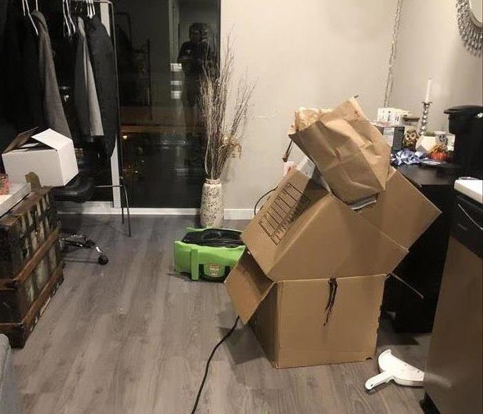 Brown boxes on a grey wood floor. 