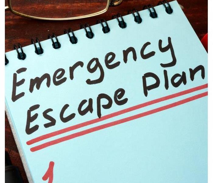 A notebook that says emergency escape plan